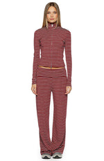 Front view of a fitted burgundy and white striped long sleeve sweater with a high neck and double zipper