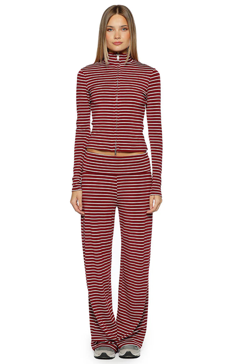 Front view of a fitted burgundy and white striped long sleeve sweater with a high neck and double zipper