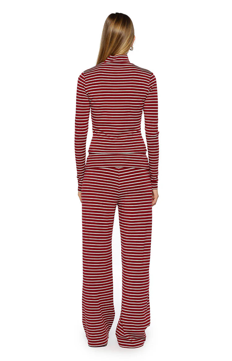 Rear view of a fitted burgundy and white striped high neck long sleeve sweater