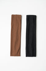 Two wide headbands, one in a soft brown ribbed knit and the other in a black ribbed knit fabric