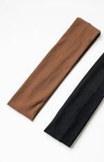 Close-up of the brown and black headbands, highlighting their fine ribbed knit texture