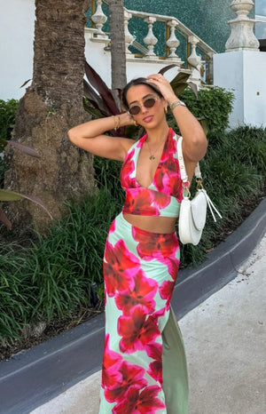 Beginning Boutique Elsa Green Floral Maxi Skirt green floral maxi skirt with large red flowers and a side split