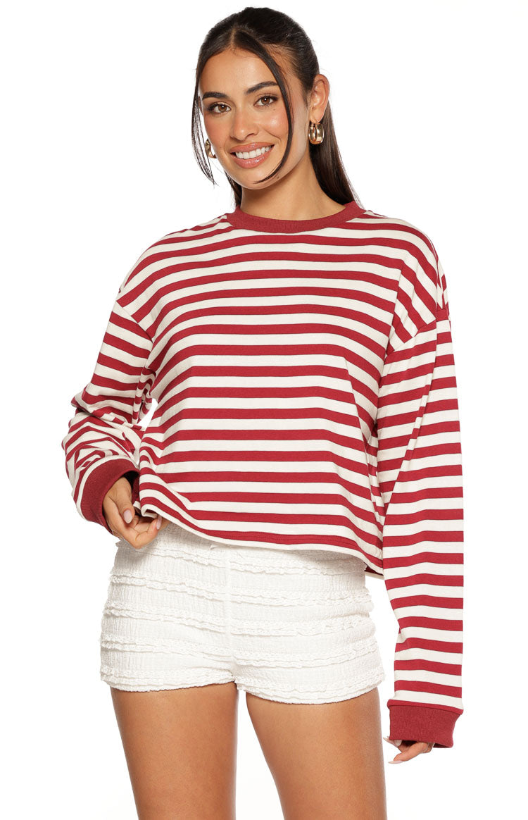 Burgundy and white striped long sleeve top with a relaxed, cropped fit, crew neck, and ribbed cuffs