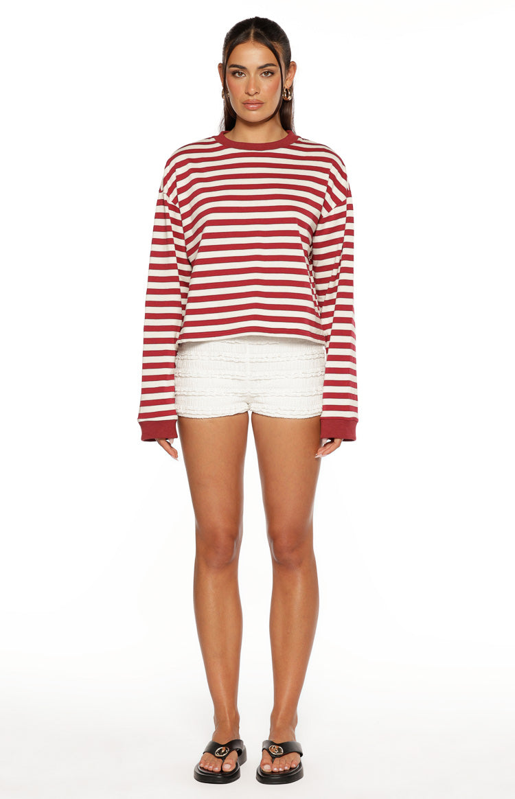 Relaxed fit burgundy and white striped long sleeve top with a cropped hem