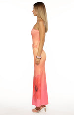 Side view of a pink ombre strapless maxi dress with a ruched side waist buckle and large hibiscus print
