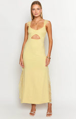 Yellow maxi dress with lace shoulder straps, a sweetheart neckline, waist cutout, and lace side panels