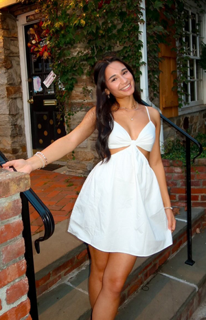 Beginning Boutique Amorgos White Mini Dress white V-neck mini dress with spaghetti straps, twisted bust detail, and waist cutouts