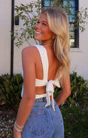 White textured top with square neckline and pink bow tie straps