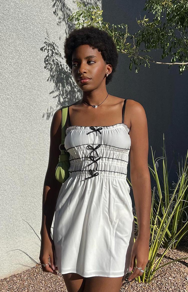 It Girl White Bow Mini Dress - US 6 | Beginning Boutique Exclusive It Girl White Bow Mini Dress - US 6 | Beginning Boutique Exclusive